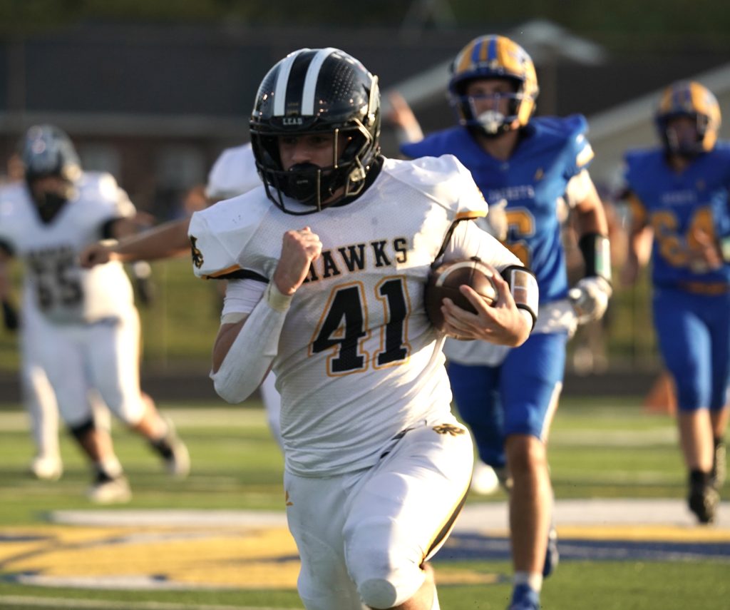 Noah Alstott enters the end zone on a touchdown carry for Springs Valley