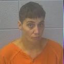 Jasper woman arrested after children found hanging out third-story window