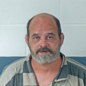 Man arrested after found passed out near road; Later fights jail officers