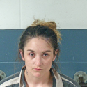 Woman arrested after found slumped over steering wheel at local Dollar Store